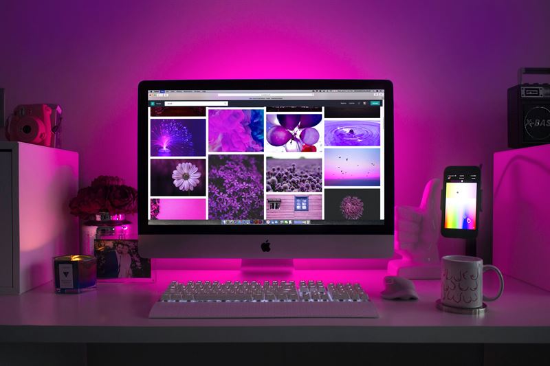 Silver iMac Displaying Collage Photos